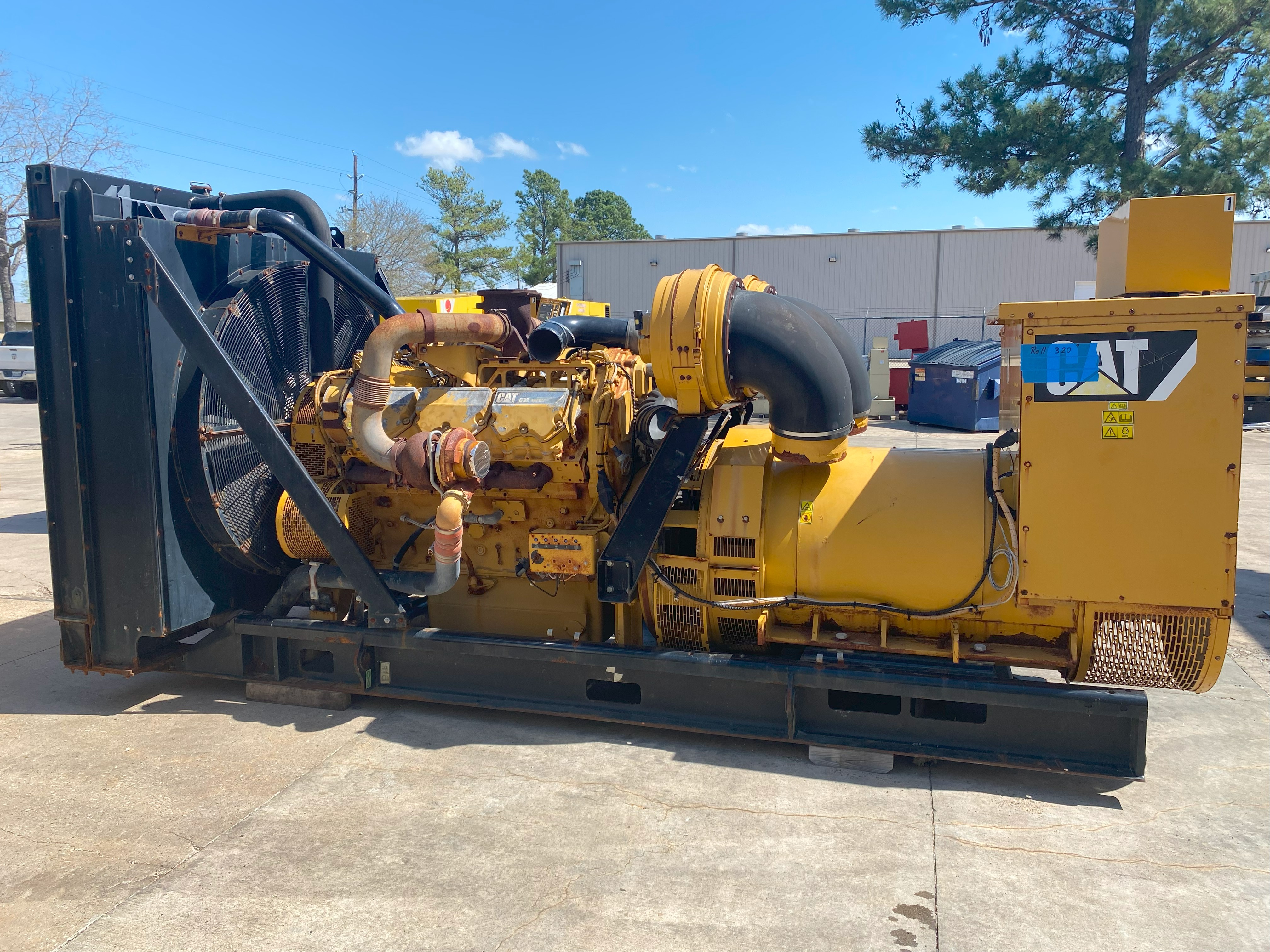 CAT C32 Generator Set (1) a large CAT C32 generator outside
